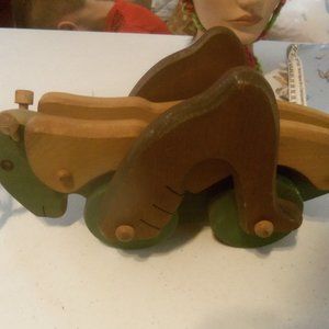 Vintage handmade wooden grasshopper pull along toy